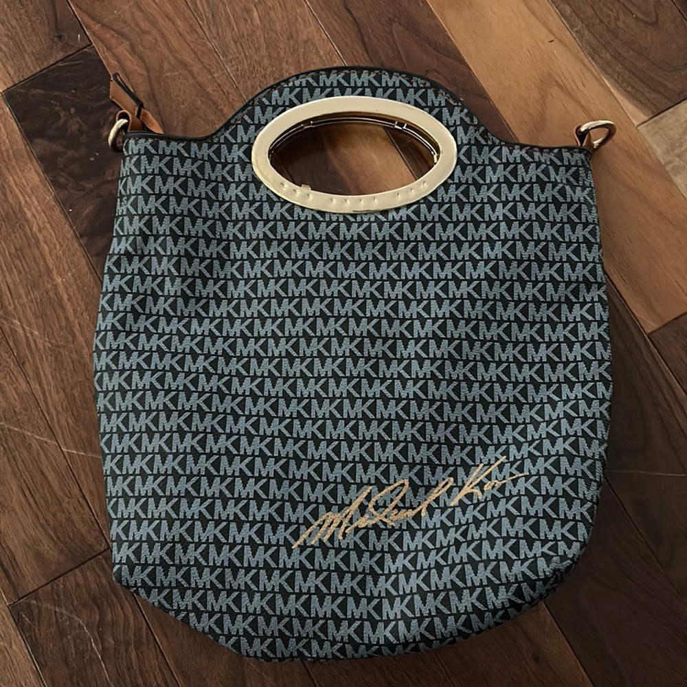 I don’t believe it’s authentic. MK bag